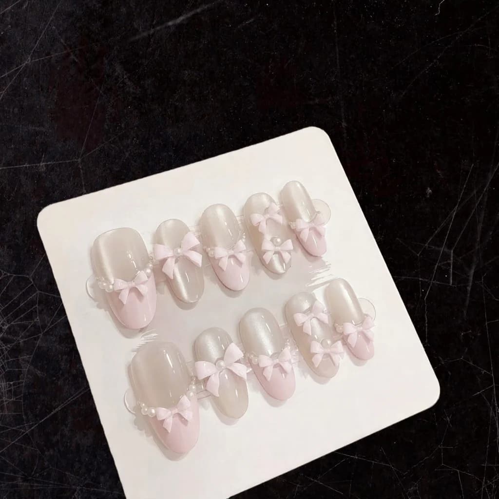 Uñas Postizas Rosa Mariposa con Efecto Ojo de Gato, Brillo y Lazo